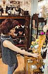 Stylish woman selecting jeweler in a antique jeweler shops