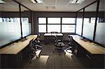 Table and empty chairs in  modern office