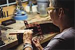 Close-up of craftswoman working in workshop