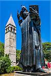 The Monument to the Bishop Grgur of Nin with the Bell Tower of St Arnir in the background in the Old Town of Split in Split-Dalmatia County, Croatia