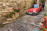 Car parked on the steep, cobblestone street in the medieval town of Motovun in Istria, Croatia