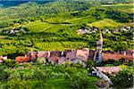 Overview of farmland and looking down on rooftops of the medieval town of Motovun in Istria, Croatia