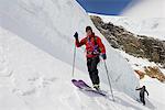 Mountaineers ski touring on snow-covered mountain, Saas Fee, Switzerland