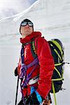 Portrait of man with mountaineering equipment looking away