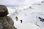 Mountaineers ascending snow-covered mountain, Saas Fee, Switzerland