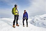 Mountaineers on top of snow-covered mountain looking away, Saas Fee, Switzerland