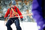 Mountaineer descending snow-covered mountain