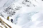 Mountaineers ski touring on snow-covered mountain, Saas Fee, Switzerland