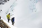 Mountaineers ski touring on snow-covered mountain, Saas Fee, Switzerland