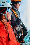 Ice climbers in ice cave looking away smiling