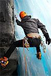 Rear view of man in cave ice climbing, Saas Fee, Switzerland