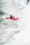 High angle view of male kayaker paddling River Dee white water rapids, Llangollen, North Wales