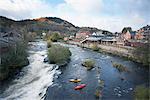 High angle view of two kayakers at the edge  of River Dee rapids, Llangollen, North Wales