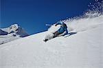 Male freestyle skier skiing down mountainside, Zugspitze, Bayern, Germany