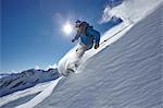 Male freestyle skier skiing down mountainside, Zugspitze, Bayern, Germany