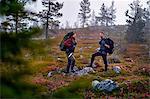 Hikers waiting in park, Sarkitunturi, Lapland, Finland