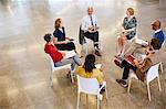 Business people talking in meeting circle