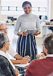 Smiling businesswoman leading meeting