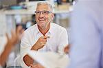 Smiling businessman in meeting