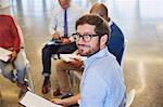 Portrait confident businessman in meeting