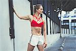 Portrait of young woman wearing sports clothing outdoors