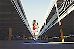 Young woman exercising in urban environment