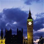 Clock tower with cloudy sky