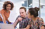 College student using laptop in classroom