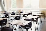 Tests on desks in empty classroom