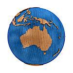 Australia on wooden model of planet Earth with embossed continents and visible country borders. 3D illustration isolated on white background.