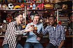 Smiling fans with a beer