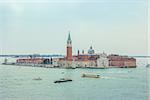 High view of San Giorgio Maggiore in Venice. Panoramic aerial view at San Giorgio Maggiore island, Venice, Veneto, Italy. Early spring. Highlighting in cold colors