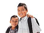 Young Hispanic Student Brothers Wearing Their Backpacks Isolated on a White Background.