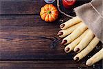 Cookies Witch's fingers for Halloween party celebration. Wooden background Copy space Top view.