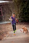 Girl running with puppy.