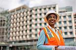 Portrait of a smiling businesswoman on a construction site.