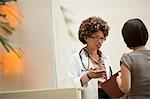 Female doctor talking to patient.