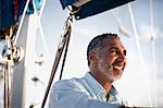 Mature man looking at view from boat.