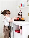 Sweden, Small girl (2-3) playing cooking