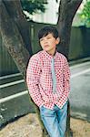 Sweden, Blekinge, Karlskrona, Portrait of boy (8-9) in checked shirt