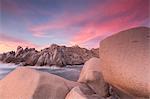 Pink sky at sunset frames the lighthouse on cliffs, Capo Testa, Santa Teresa di Gallura, Province of Sassari, Sardinia, Italy, Mediterranean, Europe