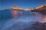 Waves frame the village perched on promontory at dusk, Castelsardo, Gulf of Asinara, Province of Sassari, Sardinia, Italy, Mediterranean, Europe