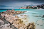 Storm clouds frame the village overlooking the turquoise sea, Santa Teresa di Gallura, Province of Sassari, Sardinia, Italy, Mediterranean, Europe