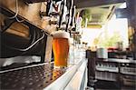 Close-up of beer pump in a row at bar