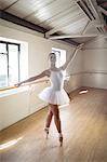 Ballerina practising ballet dance in the studio