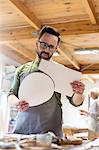 Artist examining pieces in studio