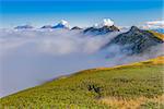 Clouds cover mountain tops at autumn evening time. Caucasus. Russia.