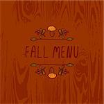 Hand-sketched typographic element with mushroom, berries and text on wooden background. Fall menu