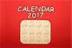 On a red background Calendar for 2017.