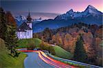 Image of  the european Alps with Maria Gern Church during beautiful autumn sunset.